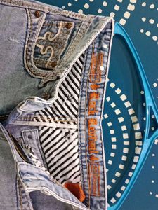 Ripped Light Wash Denim Jeans