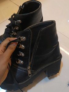 Ankle length zip closure black boots