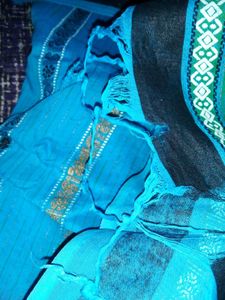 Womens Blue Cotton Saree With Golden Bady.
