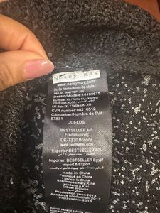A Black Sequin Top With Net Back