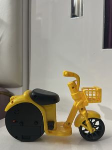 “Yellow Cycle Small Clock”