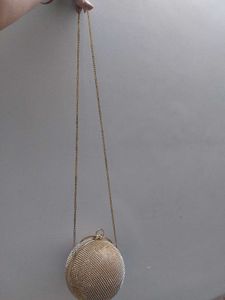 Round Studded Handheld Clutch With Metal Sling