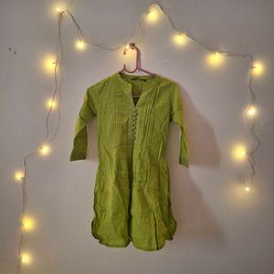 A short kurti of green colour