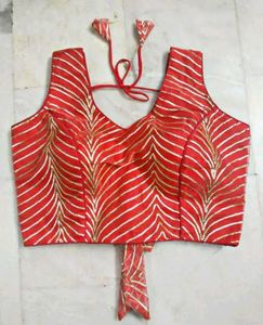Red blouse with gold leheriya