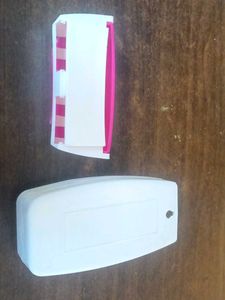 Toothpaste dispenser with toothbrush holder