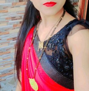 Elegant Red Saree with Black Embellishments