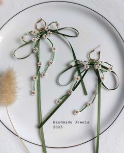 Beaded Daisy & Satin Bow Hoop Earrings