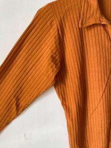 mustard brown top