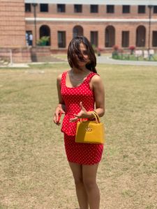 red dress with Polka Dot Handbag both