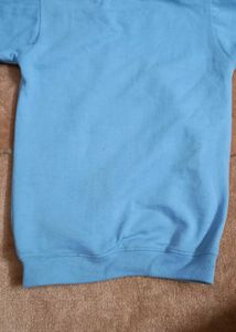 A Sky Blue Sweatershirt .