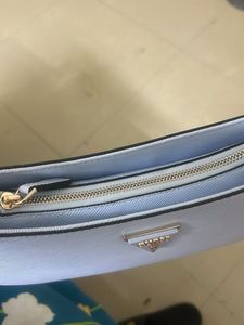 GUESS Women Solid Half Moon Fringed Shoulder bag