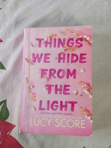 THINGS WE HIDE FROM THE LIGHT By Lucy Score