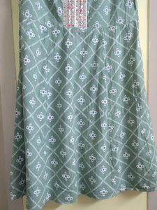 A Green Frock Type Top With Size XXL
