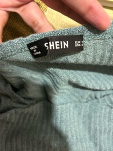 Sage green ribbed knit wrap-style top
