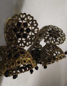 black and golden jhumka