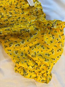Yellow Floral Smocked Top.NEW WITHOUT PRICE TAG