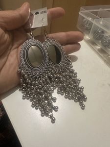 Long silver finish earrings