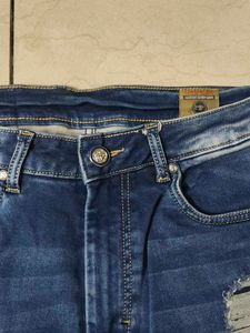 Ripped Blue Denim Jeans