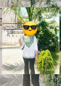 white chikankari kurti with green embroidery