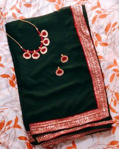 Elegant Green Saree with Pink Border