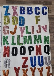 Alphabet Stickers, Feather ,crayons And Erasers