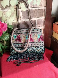 Embroidered Handbag with Moti Tassels