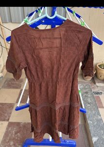 Combo of brown dress and black wide leg jeans