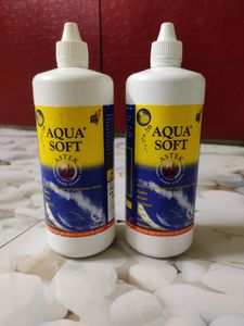 Two Large Bottles Of Aqua Soft Lens Water