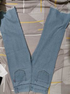 Light Wash Jeans with Button Detail