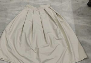 beige pleated skirt