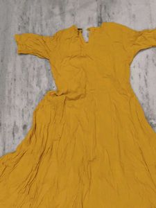 Girls wear Mustard Embroidered A-Line Kurta with s
