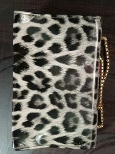 This Is A Sling Bag It Has Cheetah Print