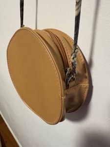 Donut shaped cross body bag