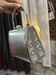 silver fancy hand bag all metal