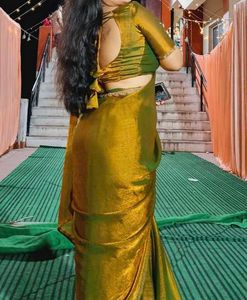 Trendy golden Saree with designer blouse