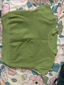 a green crop top