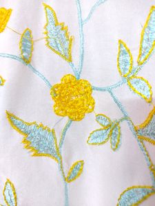 White Top With Yellow And Light Blue Embroidery