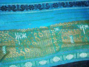Womens Blue Cotton Saree With Golden Bady.