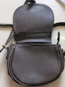 blue and dark brown sling bag