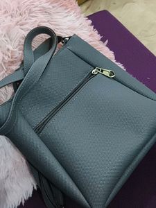 grey sling bag