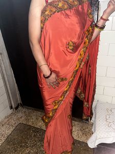 Elegant Orange Saree with Embellished Border