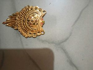 Gold Tone Pendant With Intricate Woven Texture