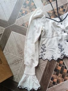 Embroidered Peplum Top