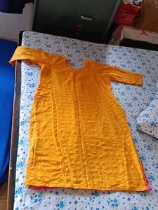 Yellow Kurti with Pink Salwar and Dupatta Set.