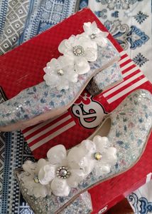 White Cinderela Shoes.