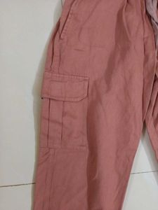 a pink cargo style joggers.