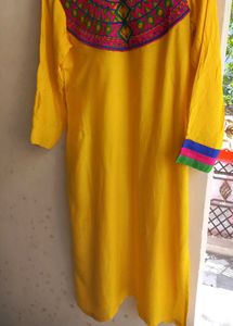 Yellow Kurti With Multicolor Embroidered Yoke