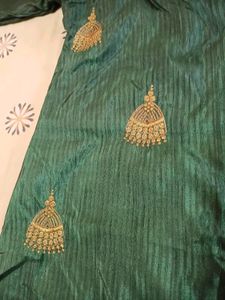 Dark Green Kurta With Golden Jumka Design