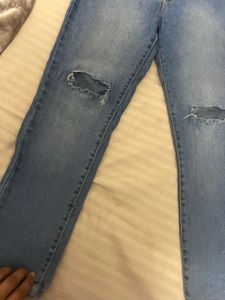 Ripped Knee Light Wash Jeans