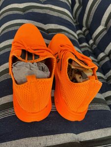 Orange sports shoes for mens